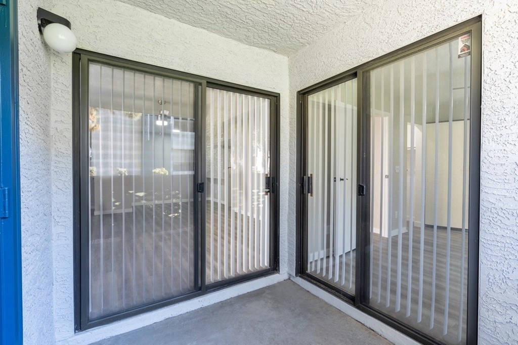 A pair of sliding glass doors with a black frame.