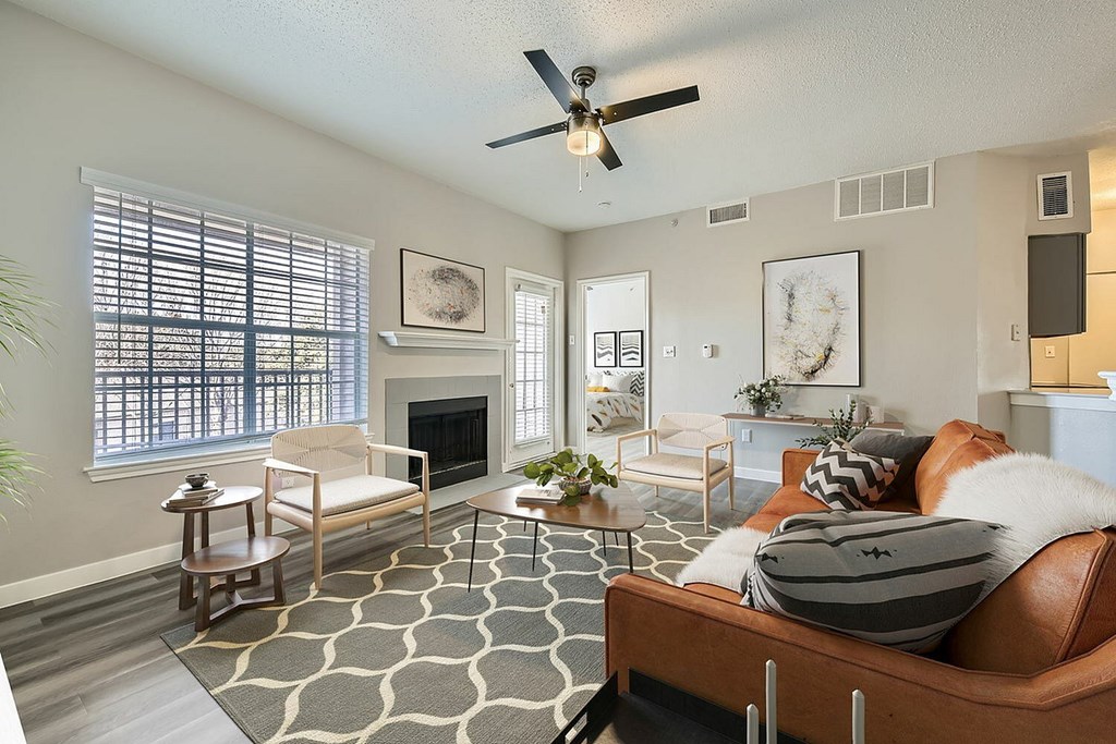 A living room with a fireplace and a couch.