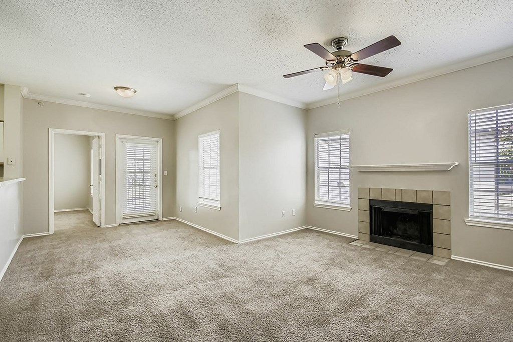 A swimming pool in front of apartment buildings.