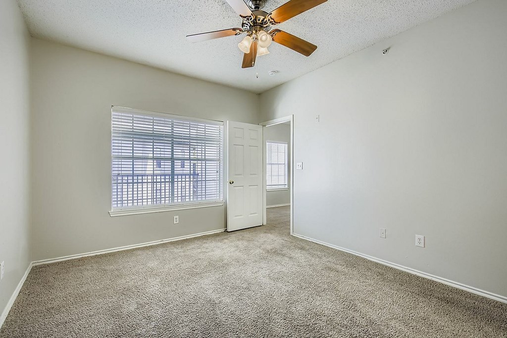 A living room with a grey couch and a coffee table.