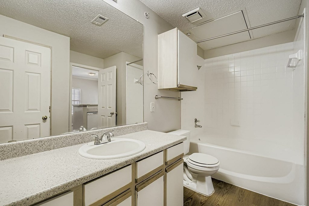 A reception area with a white counter and a red fire extinguisher.