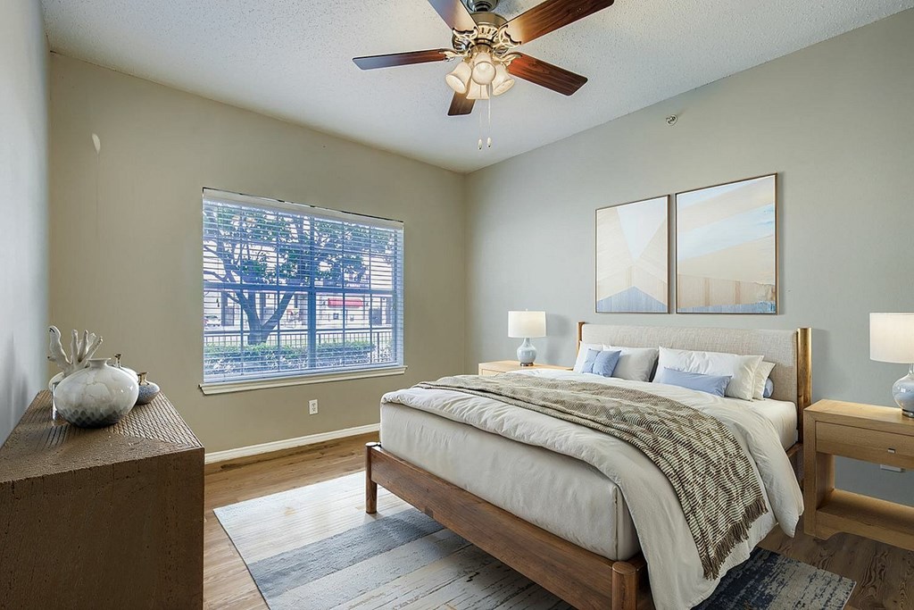 A white building with a black fence and a sign that says "Information" in front of it.