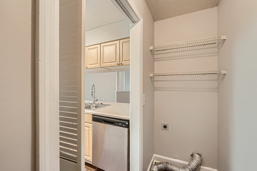 A kitchen with a dishwasher and a sink.