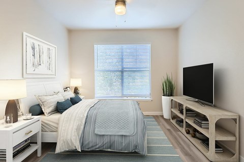 A bedroom with a bed, nightstand, and a television.