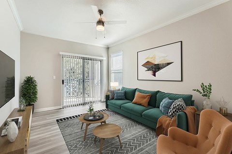 A living room with a green couch and a coffee table.