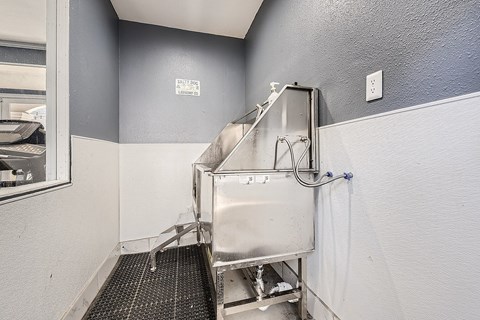 A stainless steel sink in a small room.