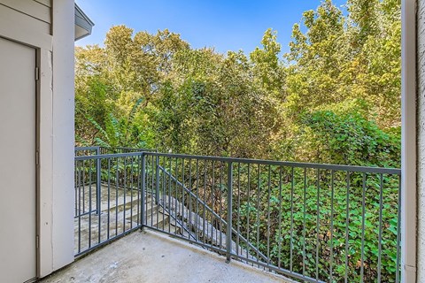 Empty room with white walls and wooden floor.
