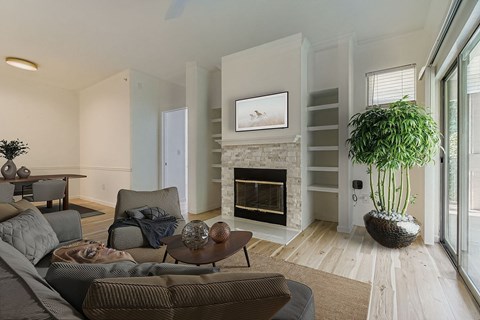 A bathroom with a sink, mirror, and toilet.