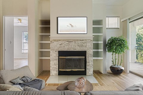 A living room with a fireplace and a couch.