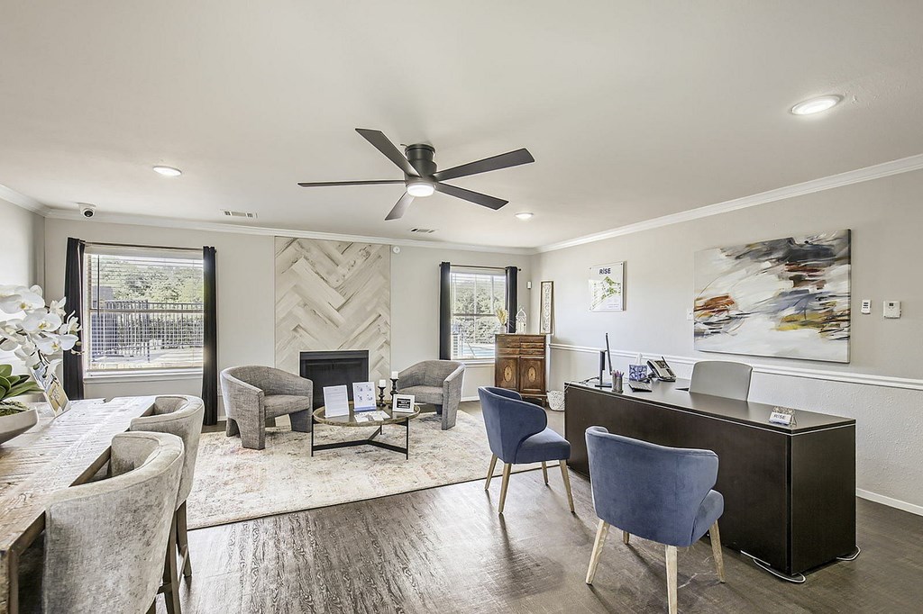 A modern living room with a fireplace and a dining table.