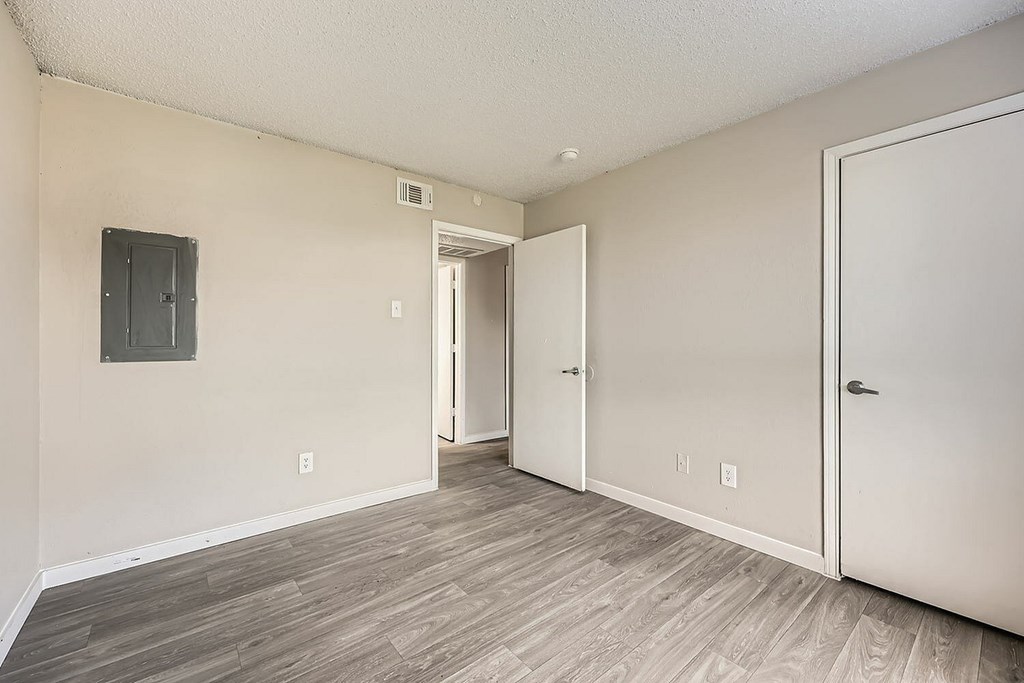 A room with a door on the right and a door on the left.