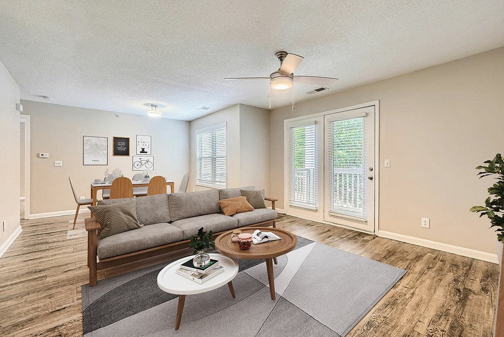 A living room with a grey sofa and a coffee table.