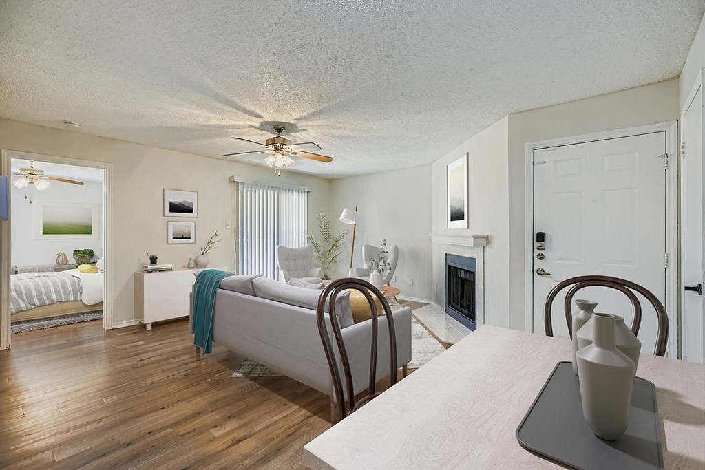 A building with a flag on top of it is surrounded by trees.