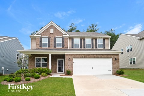 A house with a garage is for sale by FirstKey Homes.