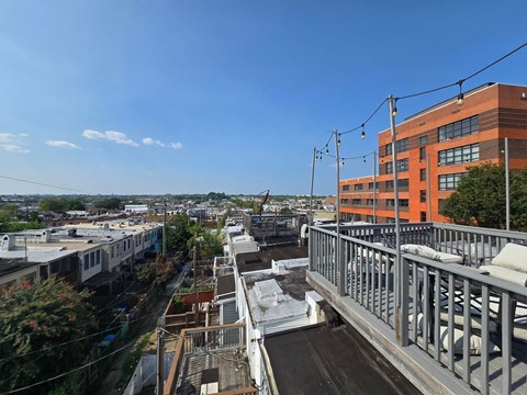 A bridge over a river with a building on the right.