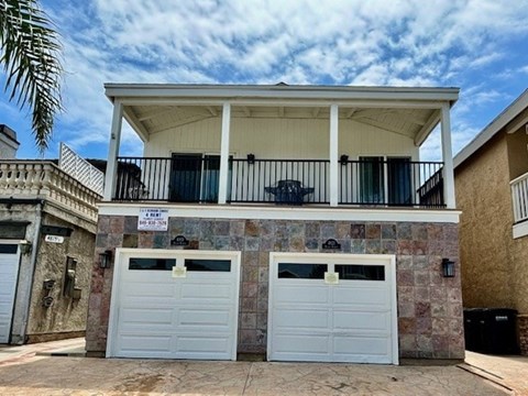 A two-car garage is attached to a house.