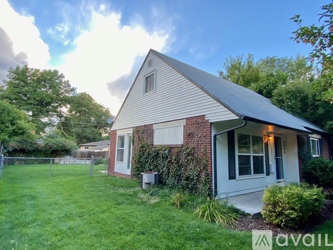 A house with a white door and a small porch.