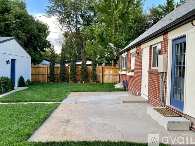 A house with a blue door is available for rent.