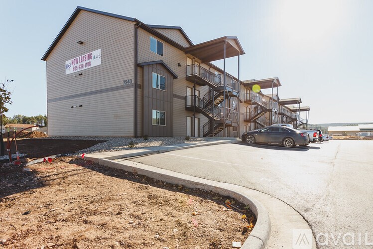 A building with a sign that says "AVAILABLE" on it.