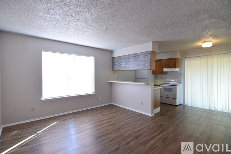 A room with wooden floors and a window.