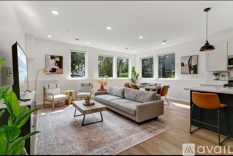 A living room with a grey sofa and a coffee table.