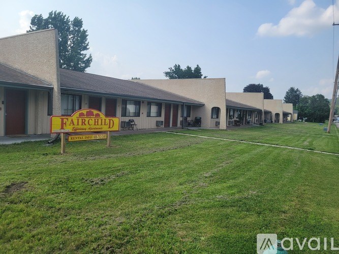 A building with a sign that says Fairchild in front of it.