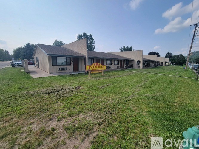 A building with a sign that says "Fairchild" in front of it.