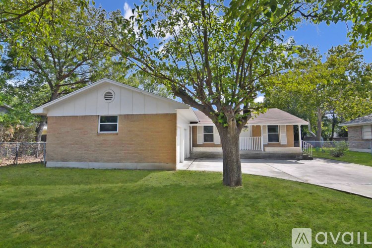 A small house with a tree in front of it.