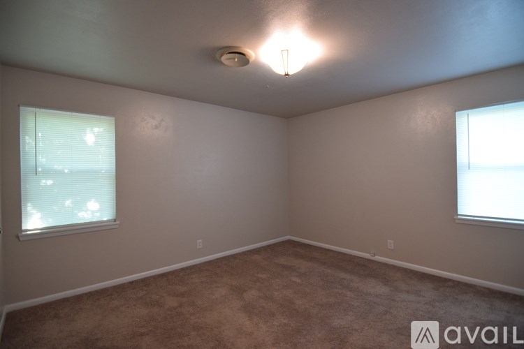 A bathroom with a toilet, tub, and sink.