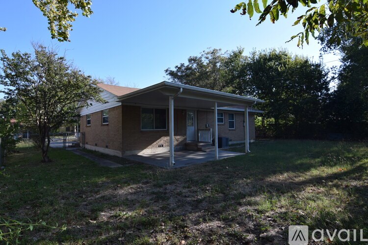 A house with a covered patio is for sale.