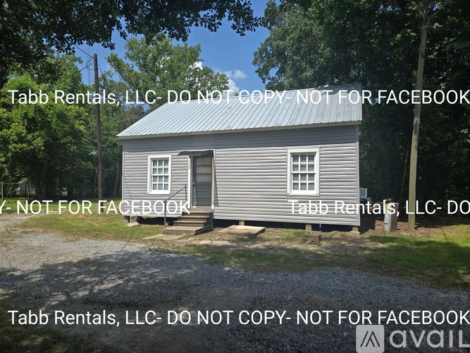 A small grey building with the text "Tabb Rentals, LLC- DO NOT COPY- NOT FOR FACEBOOK" overlaid on it.