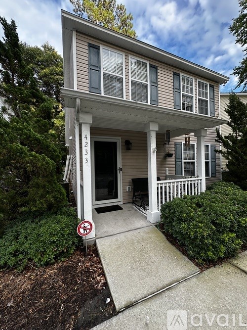 A house numbered 4233 with a no parking sign in front.