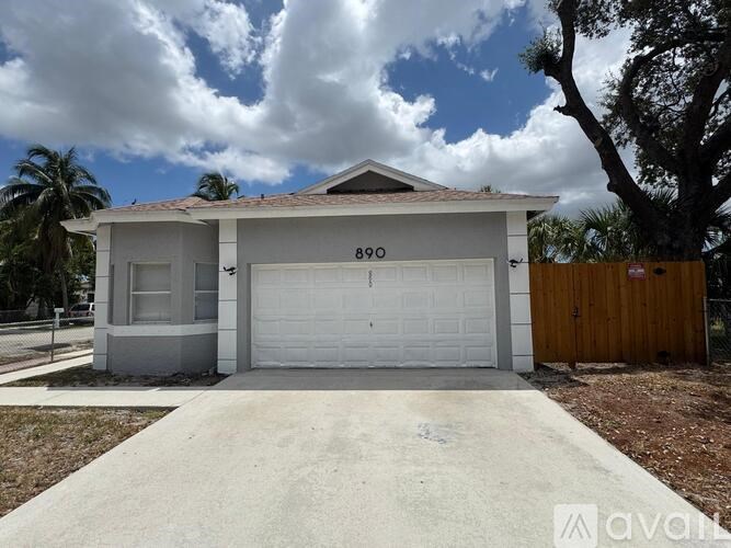 A two-car garage with the number 890 on the front door.
