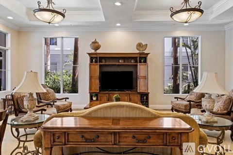 A living room with a wooden table and chairs.