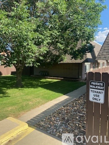 A sign on a post that says Private Walkway Tenant Use Only.