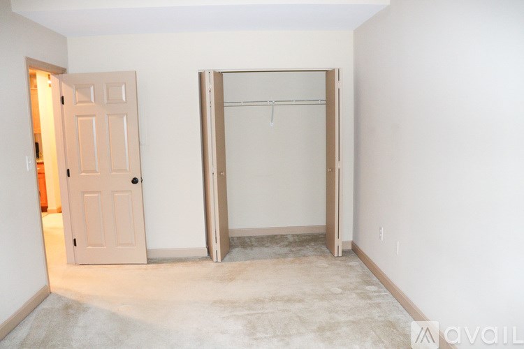 A room with a door and a wardrobe in it.