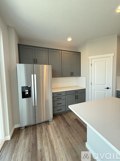 A long, empty hallway with a door at the end.