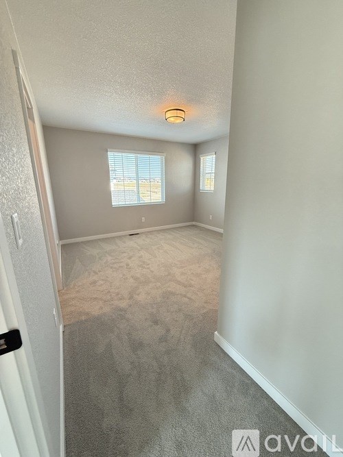 A bathroom with a sink and a window.