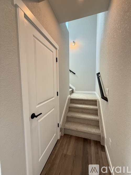 A room with a glass door leading to a construction site.