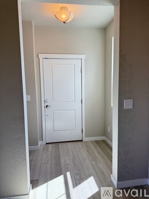 A kitchen with a white island in the middle of it.