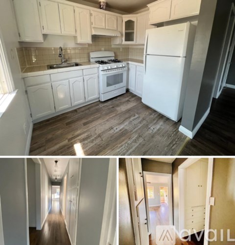 A kitchen with white cabinets and a white fridge.
