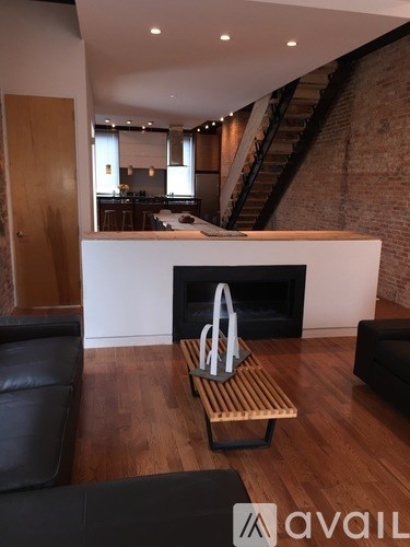 A living room with a fireplace and a couch.
