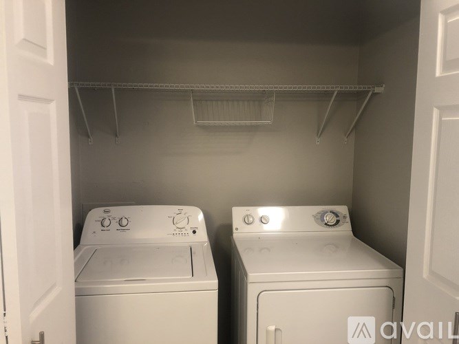 A laundry room with a washer and dryer.