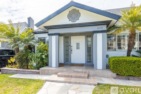 A house with the number 445 on the front door.