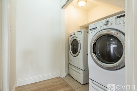Two washing machines in a laundry room.