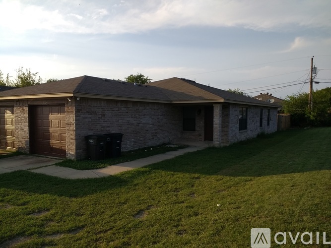 A house with a garage and a driveway.