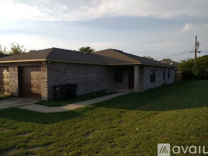 A house with a garage and a driveway.