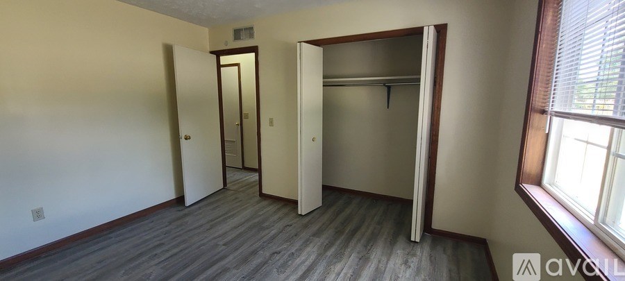 A room with a doorway leading to another room.