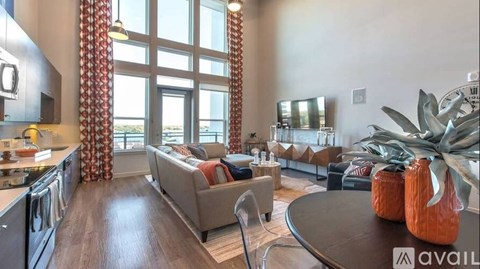 A modern kitchen with a dining table and chairs.