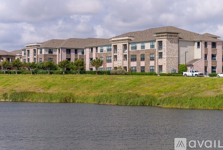 A large building with a grassy area in front of it.